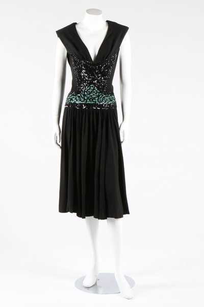 Lot 274 - A Gaston couture black crepe dinner dress,...