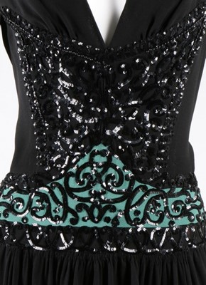 Lot 274 - A Gaston couture black crepe dinner dress,...