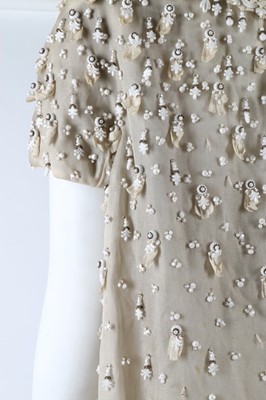 Lot 275 - A Jean Patou couture beaded white organza...