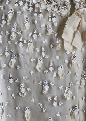 Lot 275 - A Jean Patou couture beaded white organza...