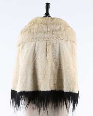 Lot 297 - An ermine cape edged in black monkey fur,...