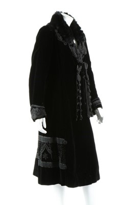 Lot 298 - A black velvet coat with frogging, circa 1910,...