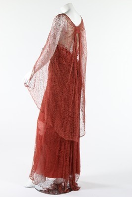 Lot 306 - A coral pink spider-web lace and chiffon...