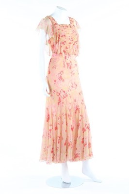 Lot 138 - A printed chiffon garden party gown, early...