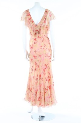 Lot 138 - A printed chiffon garden party gown, early...