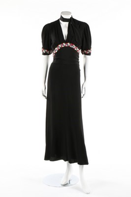 Lot 140 - A black moss crepe evening gown with sequined...