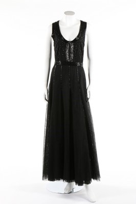 Lot 140 - A black moss crepe evening gown with sequined...