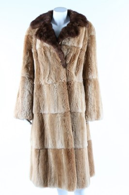 Lot 52 - Two fur coats, 1950s, one of tan fur probably...