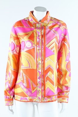 Lot 18 - Two Pucci printed silk blouses, late 1960s,...