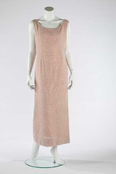 Lot 99 - A Guy Laroche couture pink beaded sheath,...