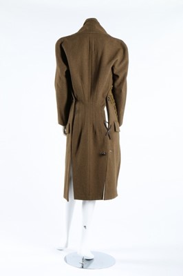 Lot 373 - A Yohji Yamamoto olive-green tweed tailcoat,...