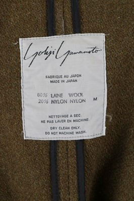 Lot 373 - A Yohji Yamamoto olive-green tweed tailcoat,...