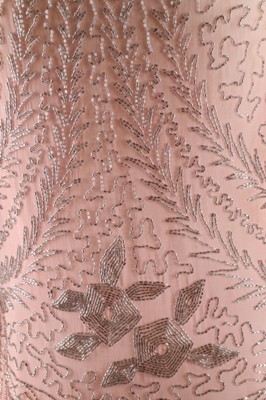 Lot 12 - A beaded pink muslin flapper dress, circa 1928,...