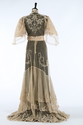 Lot 17 - An embroidered and appliqued lace bridal gown,...