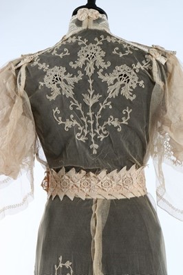Lot 17 - An embroidered and appliqued lace bridal gown,...