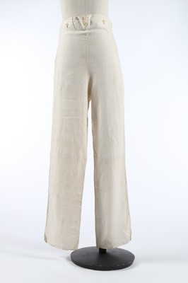 Lot 31 - A pair of men's white linen trousers, early...