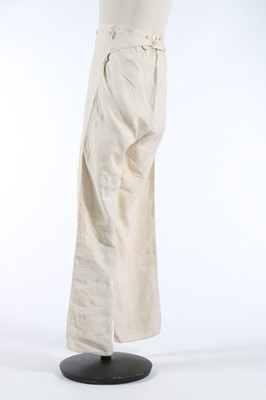 Lot 31 - A pair of men's white linen trousers, early...