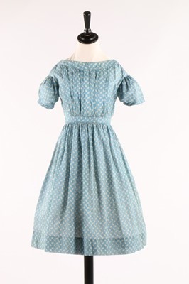 Lot 33 - Three printed cotton girl's dresses, one of...
