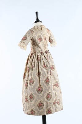 Lot 33 - Three printed cotton girl's dresses, one of...