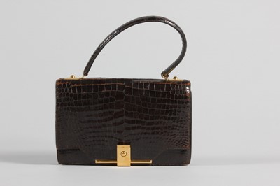 Lot 73 - An Hermès brown crocodile handbag, circa 1970,...