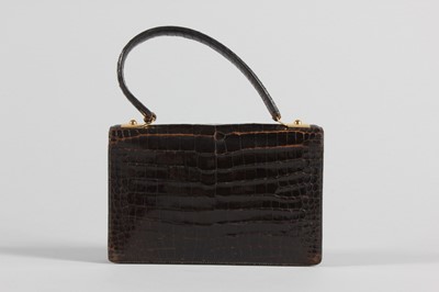 Lot 73 - An Hermès brown crocodile handbag, circa 1970,...