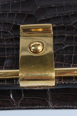 Lot 73 - An Hermès brown crocodile handbag, circa 1970,...