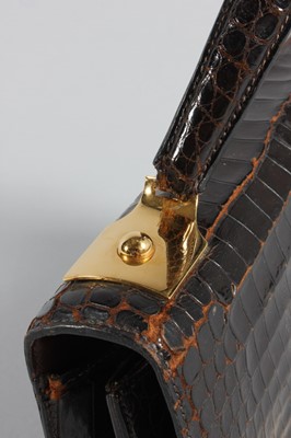 Lot 73 - An Hermès brown crocodile handbag, circa 1970,...