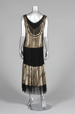 Lot 82 - A gold lamé cocktail dress, late 1920s-early...