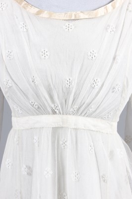 Lot 98 - A needle-run lace over-dress, circa 1820-25,...