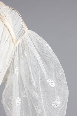 Lot 98 - A needle-run lace over-dress, circa 1820-25,...