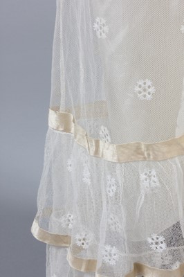 Lot 98 - A needle-run lace over-dress, circa 1820-25,...