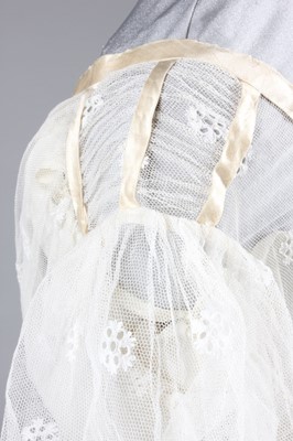 Lot 98 - A needle-run lace over-dress, circa 1820-25,...