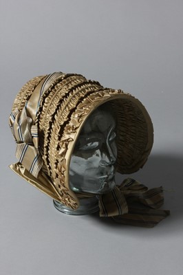 Lot 99 - A gold satin lady's bonnet circa 1840-50, with...