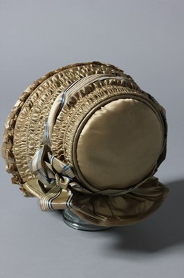 Lot 99 - A gold satin lady's bonnet circa 1840-50, with...