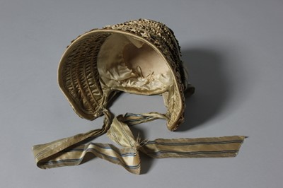 Lot 99 - A gold satin lady's bonnet circa 1840-50, with...