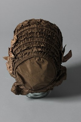 Lot 100 - A brown taffeta bonnet, circa 1850, with...