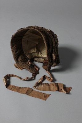 Lot 100 - A brown taffeta bonnet, circa 1850, with...