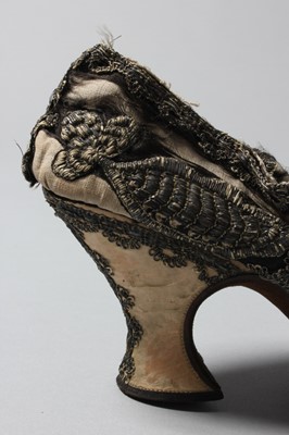 Lot 105 - A pair of lavishly embroidered black satin...