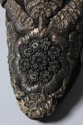 Lot 105 - A pair of lavishly embroidered black satin...