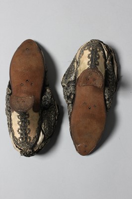 Lot 105 - A pair of lavishly embroidered black satin...