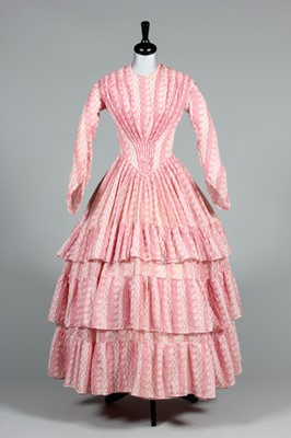 Lot 106 - A printed muslin day dress, circa 1855, with...