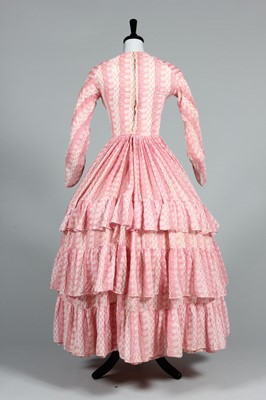 Lot 106 - A printed muslin day dress, circa 1855, with...