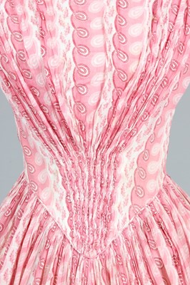 Lot 106 - A printed muslin day dress, circa 1855, with...