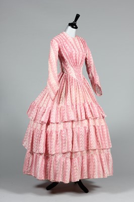 Lot 106 - A printed muslin day dress, circa 1855, with...