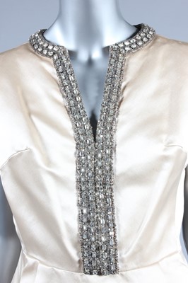 Lot 107 - A Christian Dior London ivory satin cocktail...