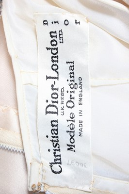 Lot 107 - A Christian Dior London ivory satin cocktail...