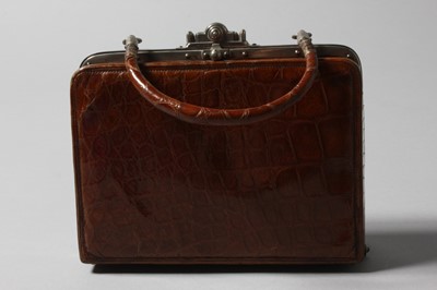 Lot 112 - An early handbag, French, circa 1910, of tan...