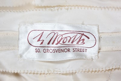 Lot 120 - A Maison Worth couture ivory satin bridal gown,...