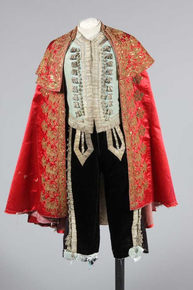 Lot 124 - A good embroidered rose satin matador cape,...