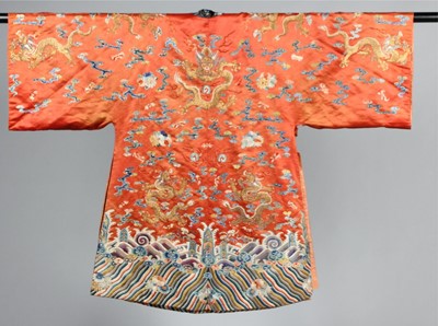 Lot 259 - An embroidered orange satin dragon robe,...
